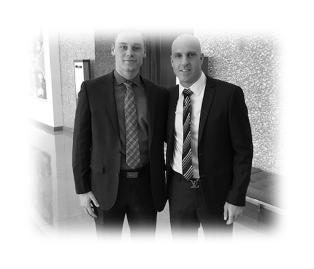 Two Driven Sports Group representatives in suits