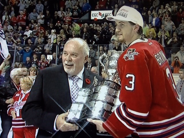 A Driven athlete accepting a championship trophy